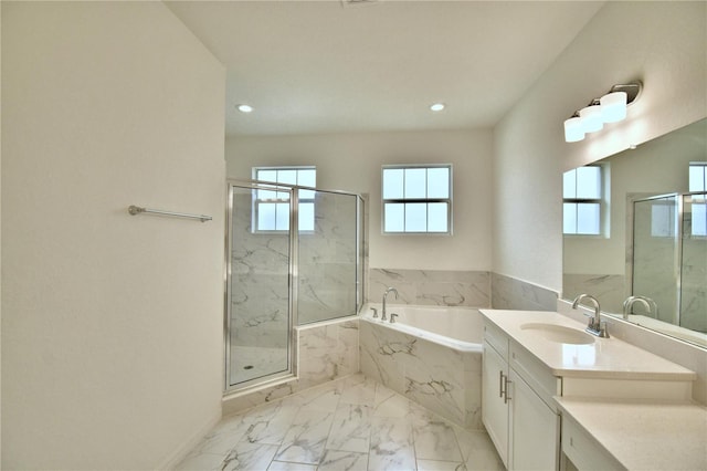 bathroom featuring vanity and plus walk in shower