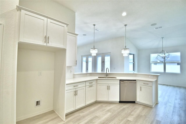 kitchen with pendant lighting, stainless steel dishwasher, and white cabinets