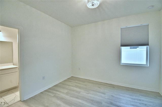 unfurnished room featuring light hardwood / wood-style floors