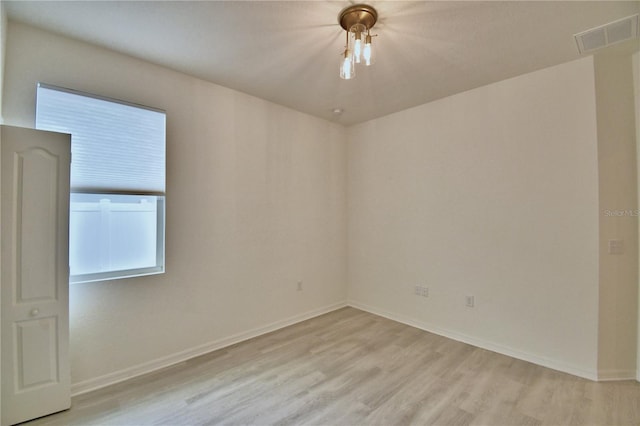 unfurnished room featuring light hardwood / wood-style flooring