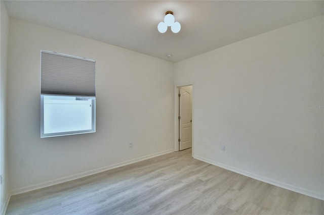 unfurnished room featuring light wood-type flooring