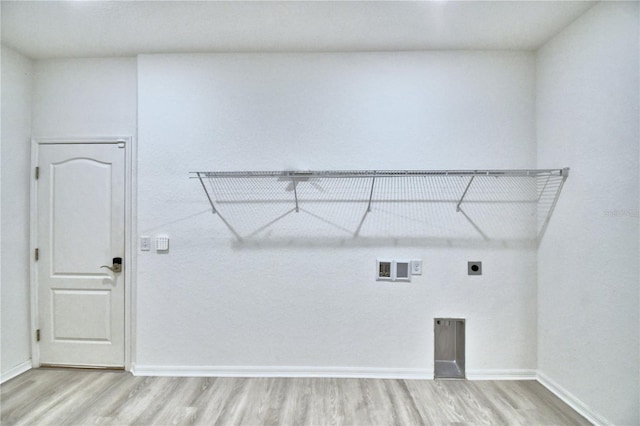 clothes washing area featuring washer hookup, hardwood / wood-style floors, and hookup for an electric dryer