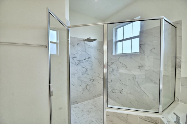 bathroom featuring an enclosed shower and vaulted ceiling