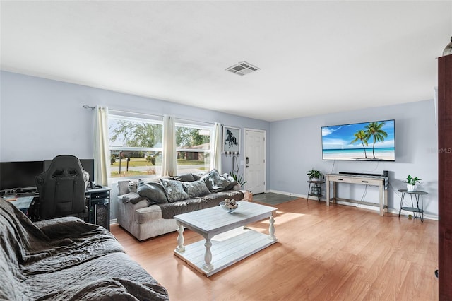 living room with light hardwood / wood-style flooring