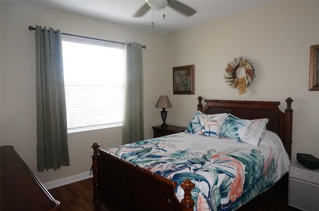 bedroom featuring wood finished floors, baseboards, and ceiling fan