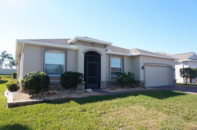 ranch-style house with concrete driveway, a front yard, roof with shingles, stucco siding, and an attached garage