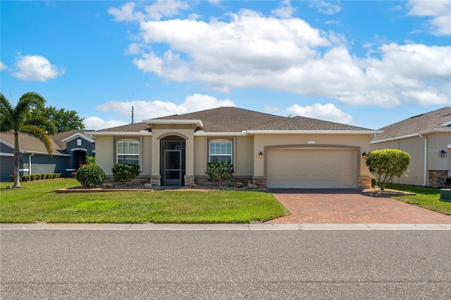 view of front of house with stone siding, an attached garage, stucco siding, a front lawn, and driveway
