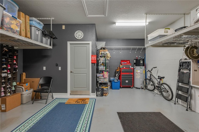 garage with water heater and concrete block wall