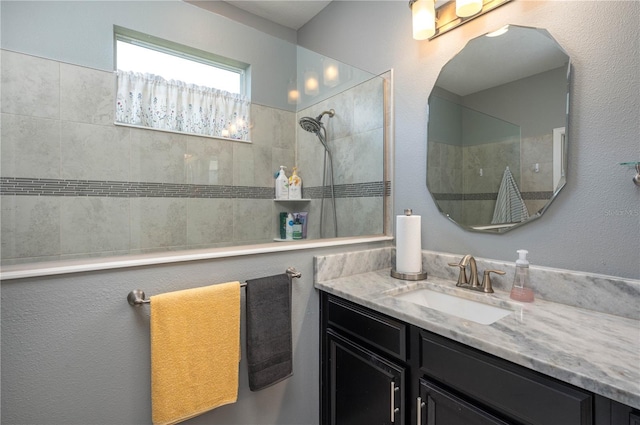 bathroom with vanity and walk in shower