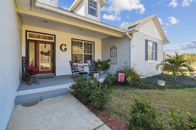 doorway to property featuring a porch