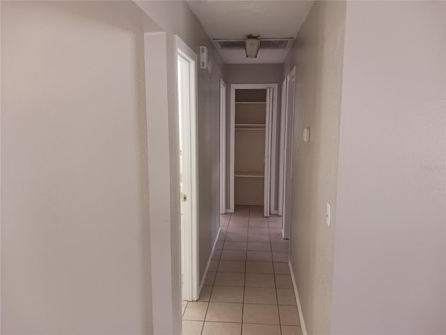 hallway with light tile patterned floors