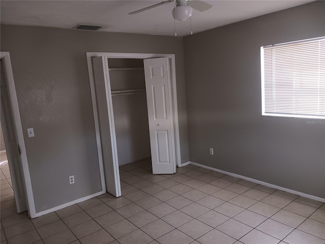 unfurnished bedroom featuring a closet and ceiling fan