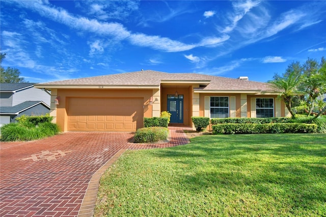 single story home featuring a garage and a front yard