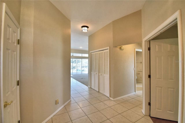 hallway featuring light tile patterned floors