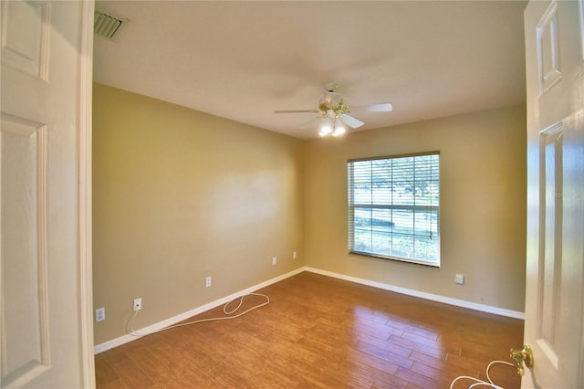 unfurnished room with hardwood / wood-style flooring and ceiling fan