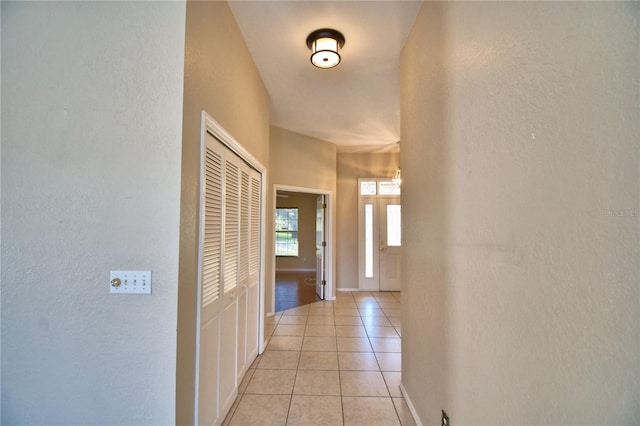 hallway featuring light tile patterned floors