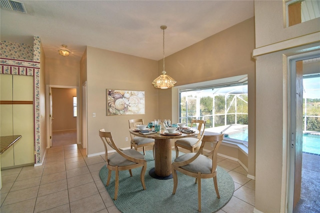 tiled dining space with a healthy amount of sunlight