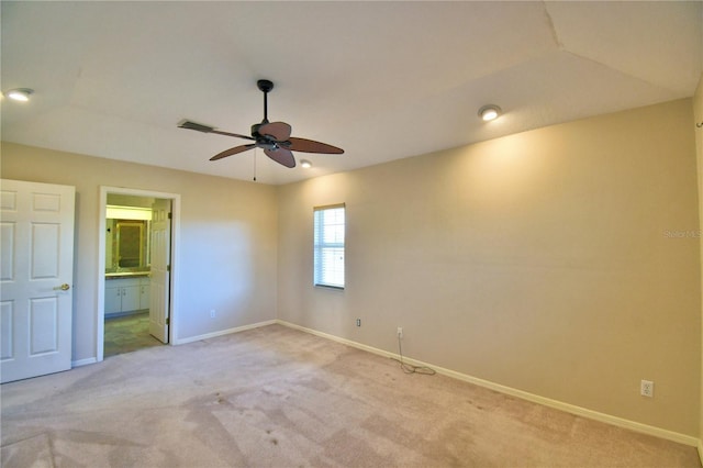 carpeted spare room with ceiling fan