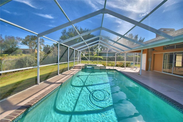 view of pool with a lanai and a patio