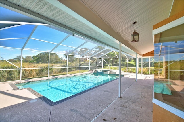 view of swimming pool with a patio area and glass enclosure