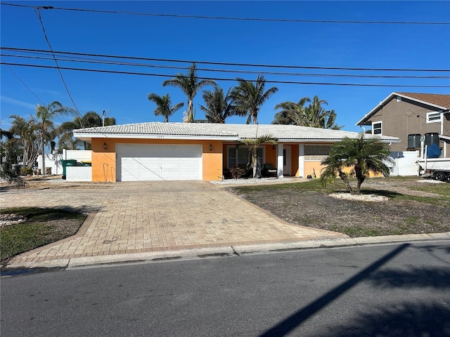 view of front of property with a garage