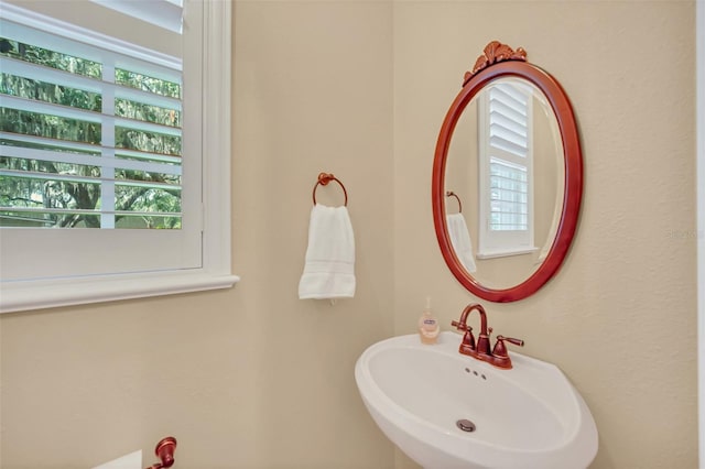 bathroom with sink and plenty of natural light