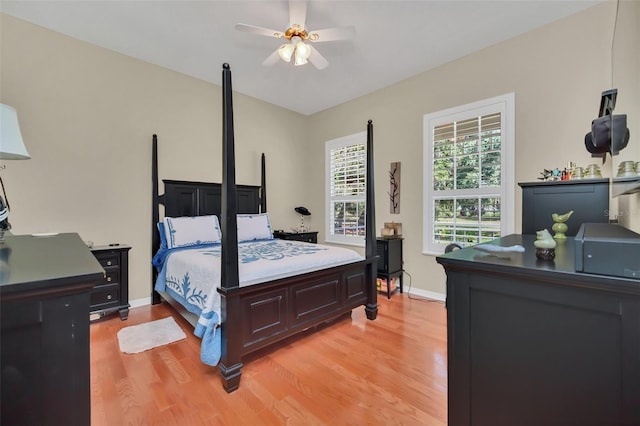 bedroom with ceiling fan and light wood-type flooring