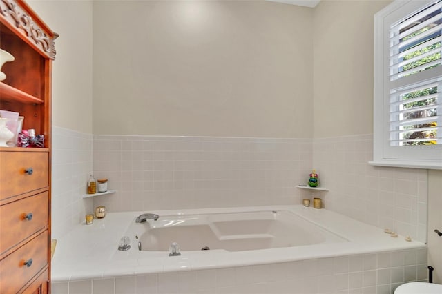 bathroom featuring tiled bath