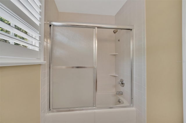 bathroom featuring enclosed tub / shower combo