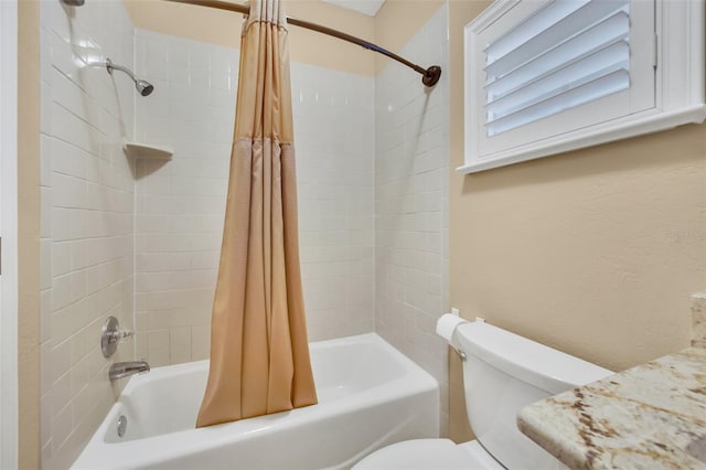 bathroom featuring toilet and shower / tub combo