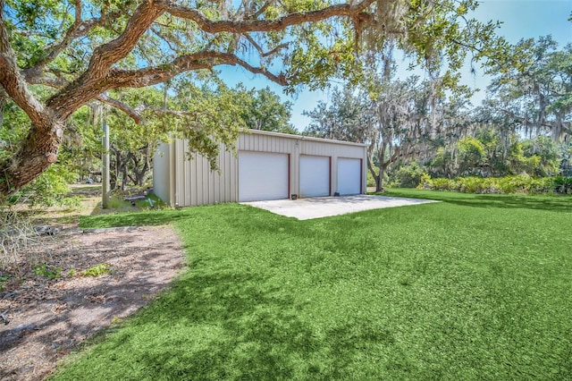 garage featuring a yard