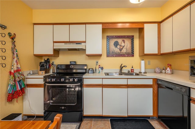 kitchen with light countertops, white cabinetry, a sink, under cabinet range hood, and black appliances