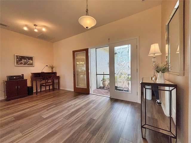 entryway with hardwood / wood-style floors