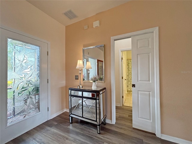 entrance foyer featuring dark hardwood / wood-style floors