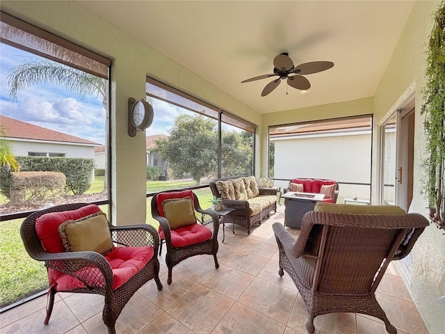 sunroom with ceiling fan