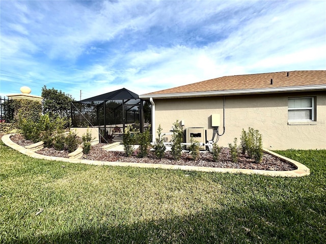 view of yard featuring glass enclosure