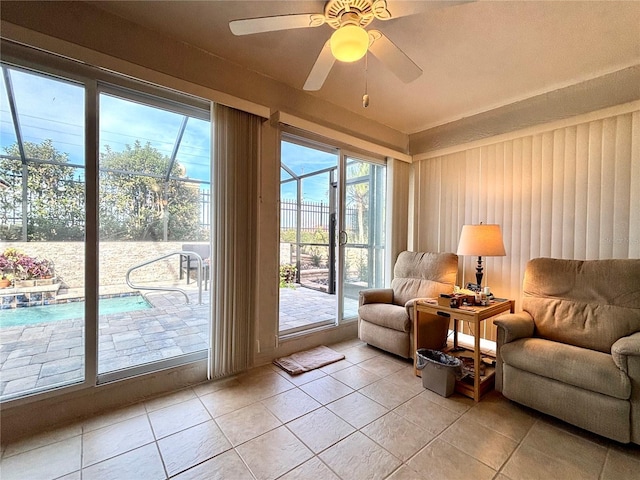 entryway featuring light tile patterned floors and ceiling fan