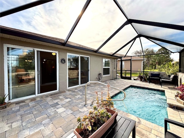 view of pool with a lanai and a patio