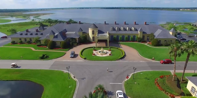 birds eye view of property with a water view