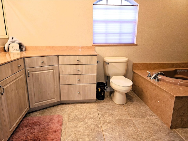 bathroom featuring tile patterned flooring, a bath, and toilet