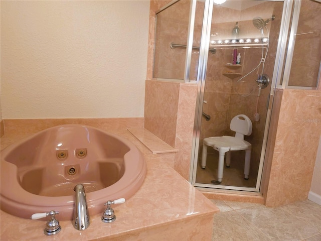 bathroom with tile patterned floors and separate shower and tub