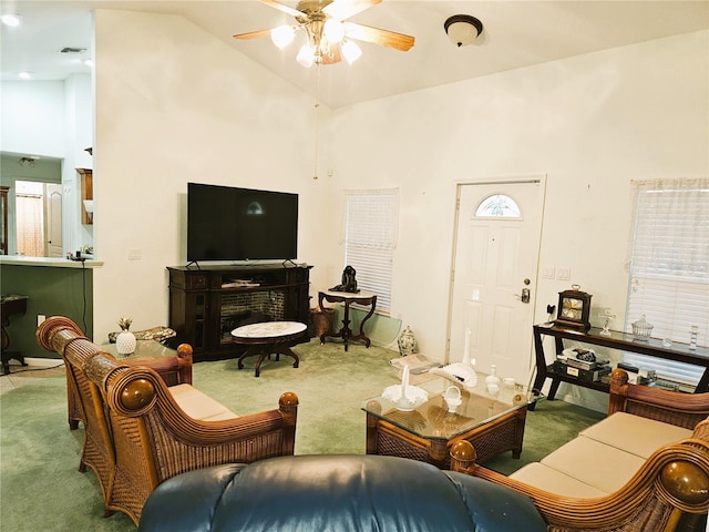 carpeted living room featuring high vaulted ceiling and ceiling fan