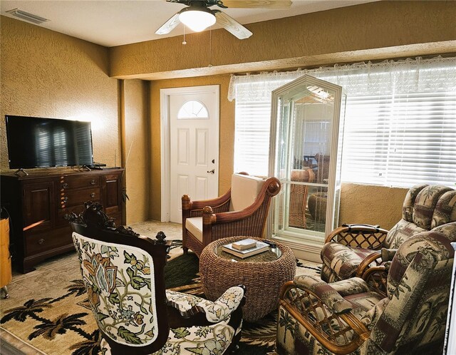 living room with ceiling fan