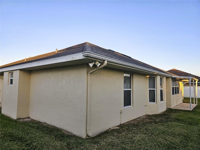 view of property exterior with a yard