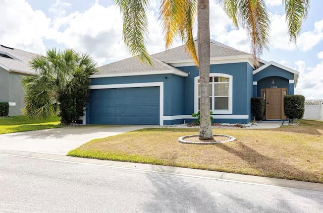 ranch-style home featuring a garage and a front lawn