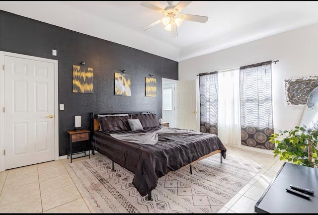 bedroom with light tile patterned floors and ceiling fan