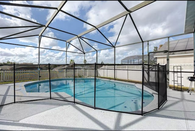 view of pool with a lanai and a patio area