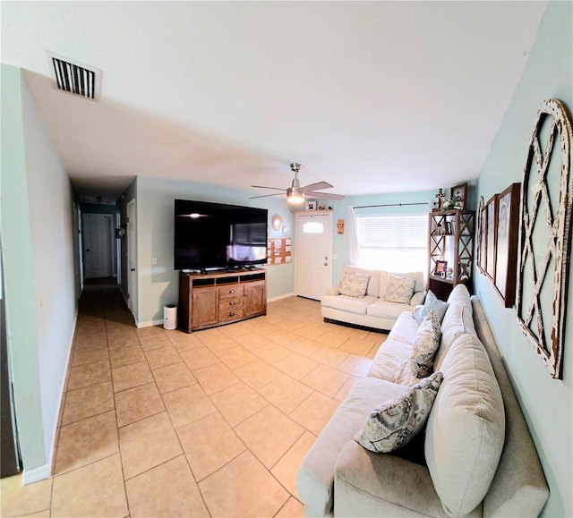 living room with light tile patterned floors and ceiling fan