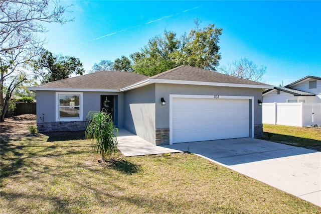 ranch-style house with a garage and a front lawn