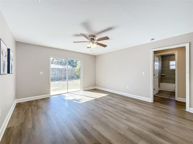 empty room featuring hardwood / wood-style flooring and ceiling fan